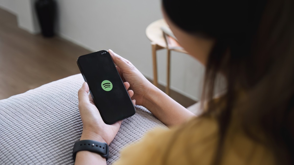 CHIANG MAI ,THAILAND DEC 15, 2023 : Apple iPhone14 smartphone with Spotify app on screen. Model Released Property Released xkwx music spotify apple editorial illustrative screen iphone logo streaming  ...