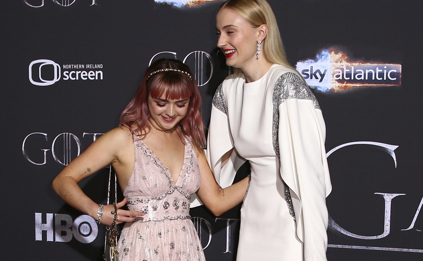 Actresses Maisie Williams, left, and Sophie Turner pose for photographers at the premiere of season eight of the television show &#039;Game of Thrones&#039; in Belfast, Northern Ireland, Friday, April ...