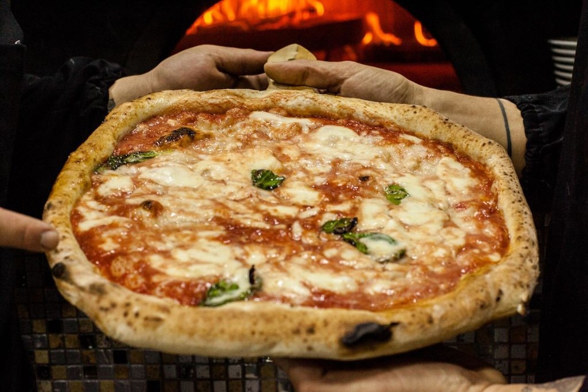 Pizzeria O'Barone in Naples, Italy, on 6 December 2017. The decision on the inscription of the art of Neapolitan pizza makers in the representative list of UNESCO World Heritage sled for a few ho ...