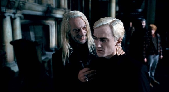 Jason Isaacs and Tom Felton as Lucius and Draco Malfoy.