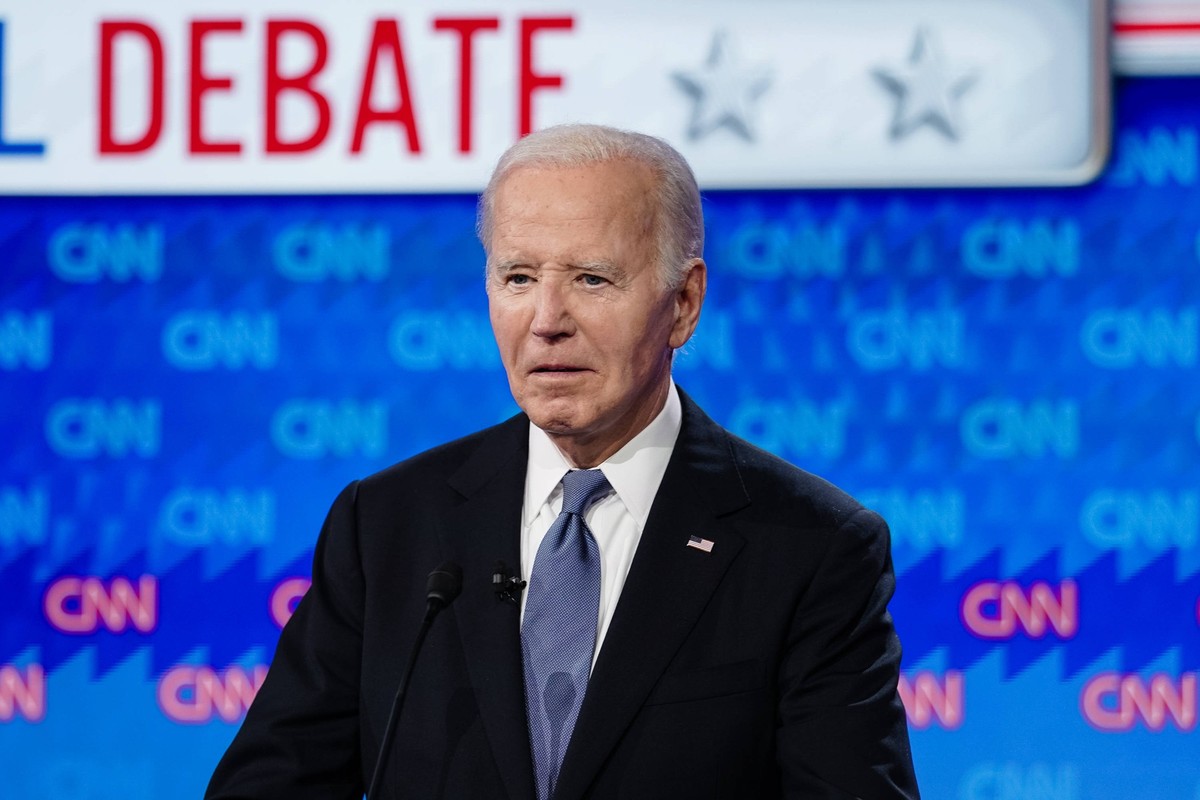 President Joe Biden stands on the stage during a break in the CNN presidential election debate against former President Donald Trump in Atlanta, Georgia on Thursday, June 27, 2024. The debate will be  ...