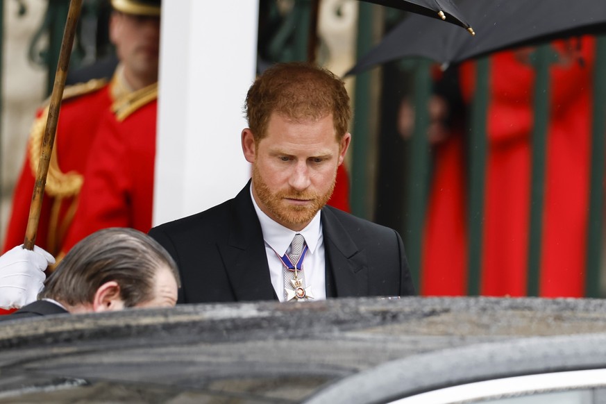 LONDON, ENGLAND - MAY 06: Prince Harry, Duke of Sussex departs the Coronation of King Charles III and Queen Camilla on May 06, 2023 in London, England. The Coronation of Charles III and his wife, Cami ...