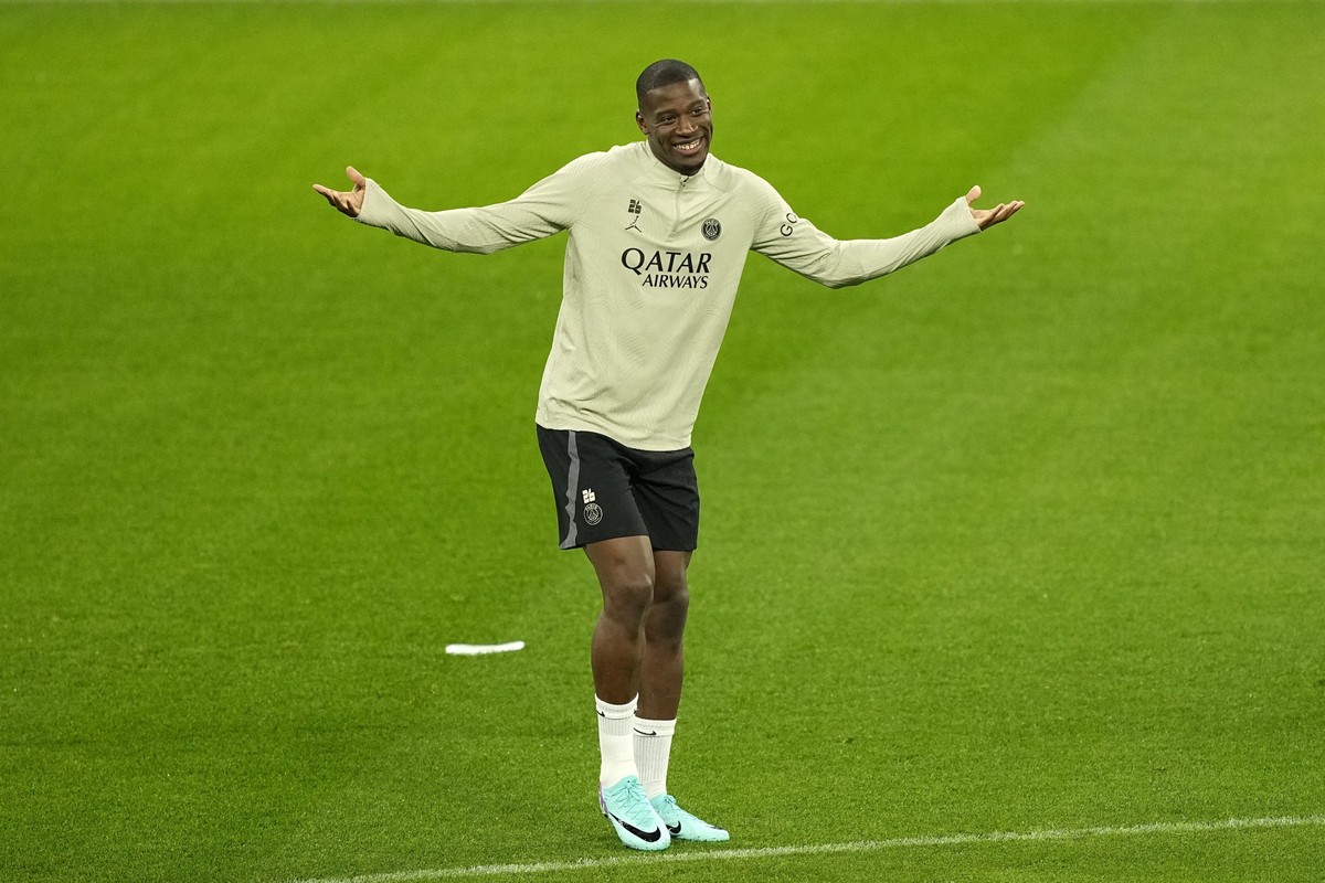 PSG's Nordi Mukiele reacts during a training session ahead of the Champions League Group F soccer match between Borussia Dortmund and Paris Saint-Germain in the Signal Iduna Park in Dortmund, Ger ...