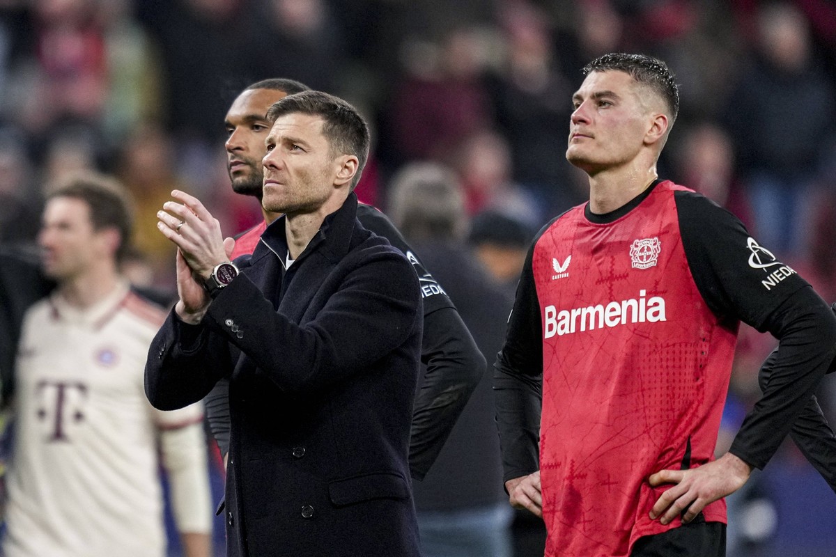 LEVERKUSEN, GERMANY - MARCH 11: Bayer 04 Leverkusen head coach Xabi Alonso and Patrik Schick of Bayer 04 Leverkusen looks dejected after the UEFA Champions League 2024/25 UEFA Champions League 2024/25 ...