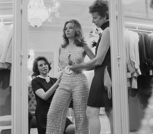Franco-American actress and dancer Leslie Caron during a fitting for Dior by fashion designer Jorn Langberg (1930 - 2014), UK, 1st April 1968. (Photo by David Cairns/Daily Express/Getty Images)
