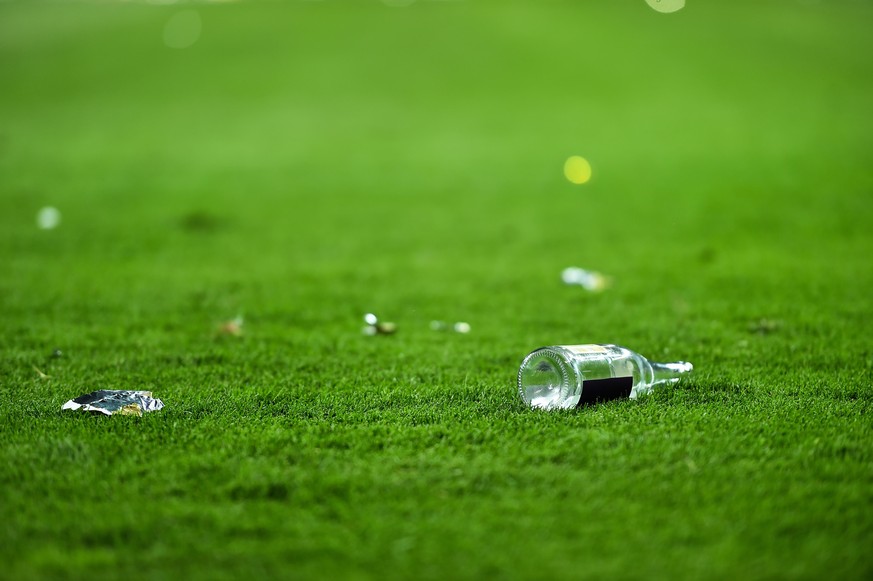 Plastic trash can on the turf on a soccer field