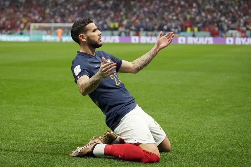 France&#039;s Theo Hernandez, center, celebrates after scoring the opening goal during the World Cup semifinal soccer match between France and Morocco at the Al Bayt Stadium in Al Khor, Qatar, Wednesd ...