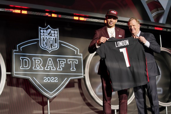 Southern California wide receiver Drake London stands with NFL Commissioner Roger Goodell after being chosen by the Atlanta Falcons with the eighth pick of the NFL football draft Thursday, April 28, 2 ...