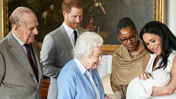 In this image made available by SussexRoyal on Wednesday May 8, 2019, Britain&#039;s Prince Harry and Meghan, Duchess of Sussex, joined by her mother Doria Ragland, show their new son to Queen Elizabe ...