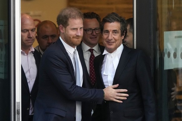 Prince Harry, centre, and David Sherborne, Prince Harry&#039;s lead lawyer, right, leave the High Court after giving evidence in London, Wednesday, June 7, 2023. Prince Harry has given evidence from t ...