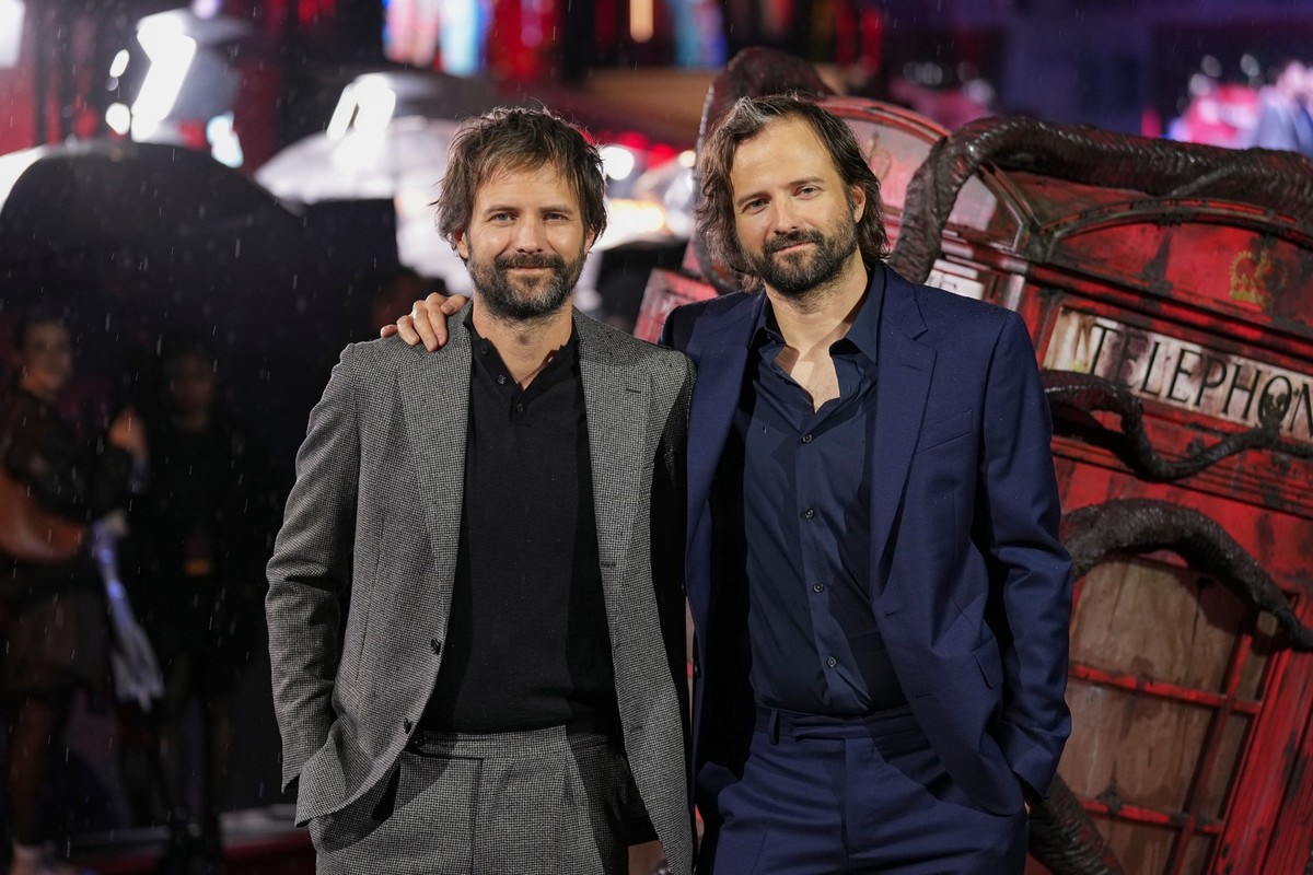 Ross Duffer, left and Matt Duffer pose for photographers upon arrival at the Stranger Things Season 5 Premiere in London, Thursday, Nov. 13, 2025. (Photo by Scott A Garfitt/Invision/AP)
