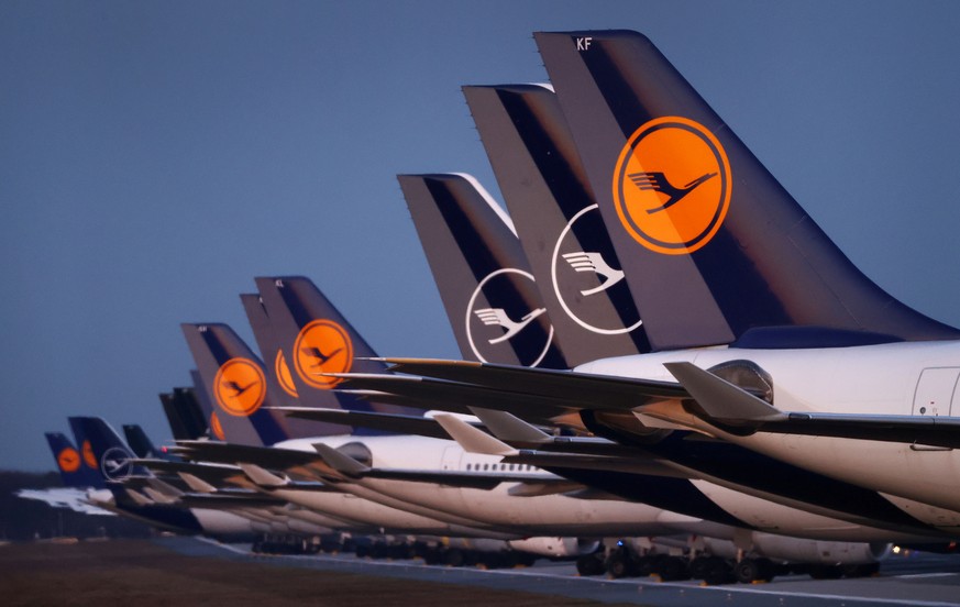 FILE PHOTO: Planes of German carrier Lufthansa parked on a closed runway at Frankfurt airport, Germany, March 23, 2020, as the spread of the coronavirus continues. REUTERS/Kai Pfaffenbach/File Photo