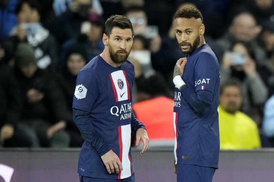 PSG&#039;s Neymar, right, talks to PSG&#039;s Lionel Messi during the French League One soccer match between Paris Saint-Germain and Angers at the Parc des Princes in Paris, France, Wednesday, Jan. 11 ...