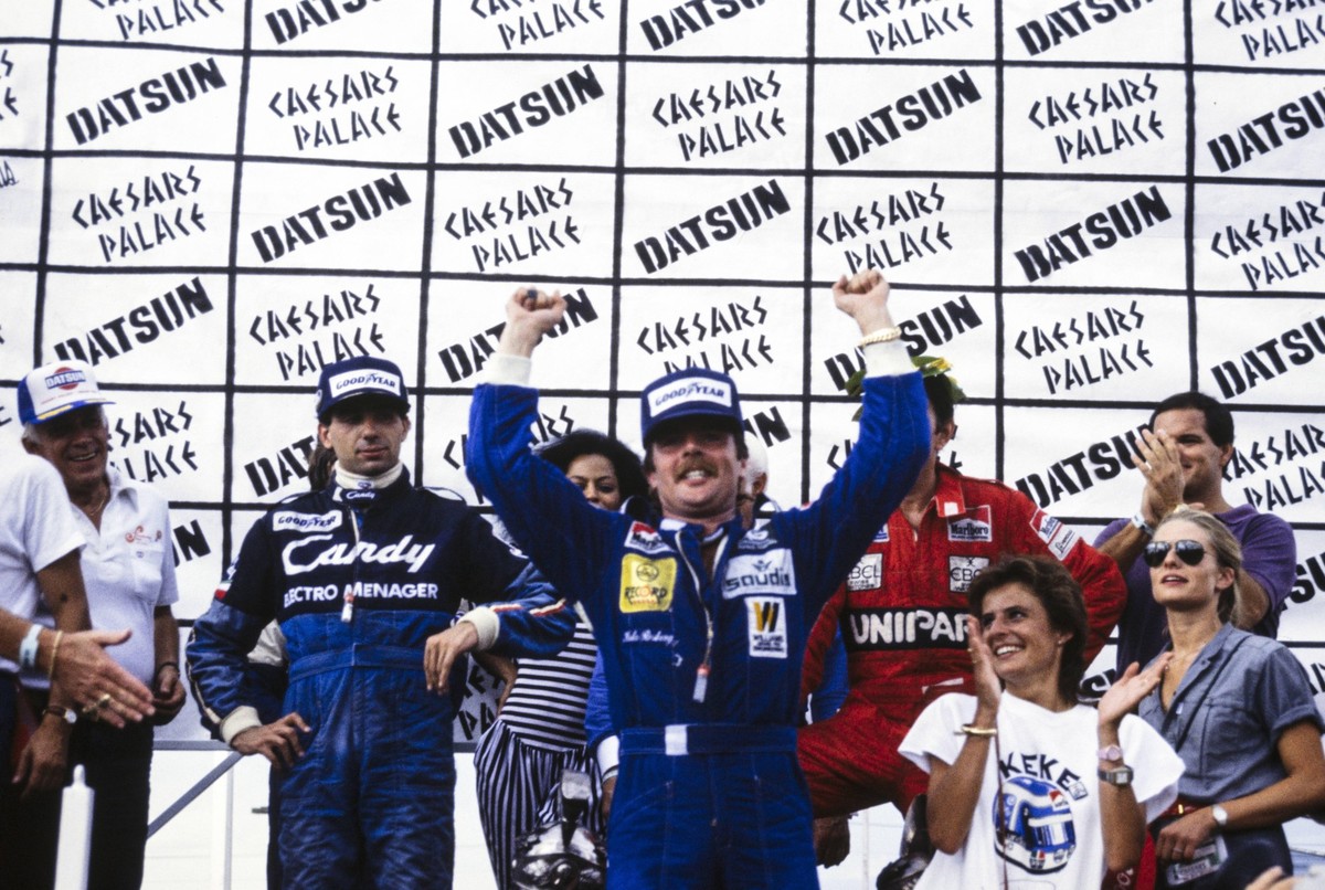 1982 Caesars Palace GP STREETS OF LAS VEGAS, UNITED STATES OF AMERICA - SEPTEMBER 25: Keke Rosberg celebrates his maiden World Championship, WM, Weltmeisterschaft on the podium during the Caesars Pala ...