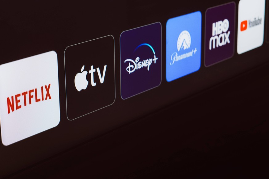 January 8, 2024, Brazil. In this photo illustration the Netflix, Apple TV, Disney Plus, Paramount Plus, HBO Max and YouTube logo is displayed on a TV screen. January 8, 2024, Brazil. In this photo ill ...