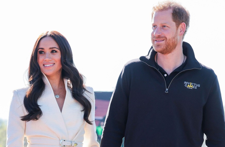 THE HAGUE, NETHERLANDS - APRIL 17: Prince Harry, Duke of Sussex and Meghan, Duchess of Sussex attend the Athletics Competition during day two of the Invictus Games The Hague 2020 at Zuiderpark on Apri ...