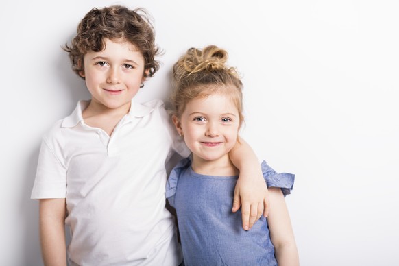 Happy Brother and Sister Hugging each other