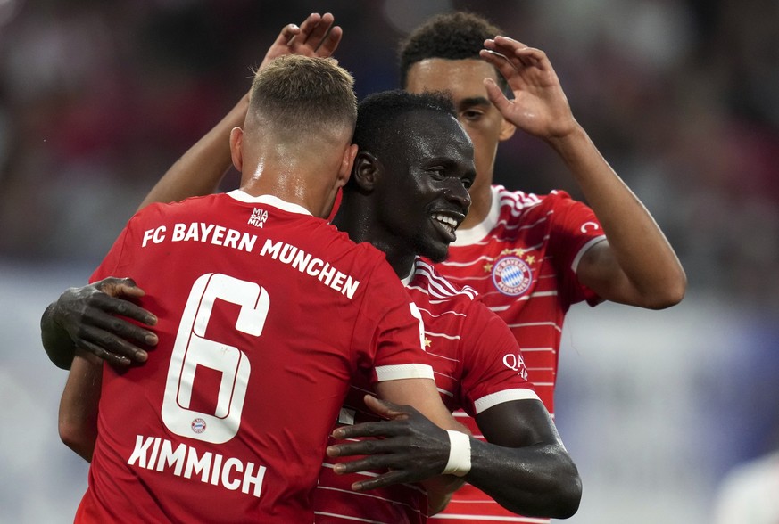 Bayern&#039;s scorer Sadio Mane, center, and his teammates Joshua Kimmich, left, and Jamal Musiala, rear, celebrate their side&#039;s 2nd goal during the German Supercup 2022 soccer match between Germ ...