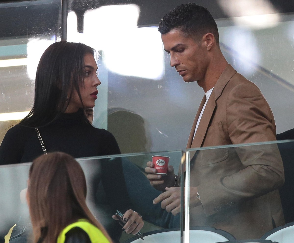 TURIN, ITALY - OCTOBER 02: Cristiano Ronaldo and Georgina Rodriguez are seen during the Group H match of the UEFA Champions League between Juventus and BSC Young Boys at Allianz Stadium on October 2, ...