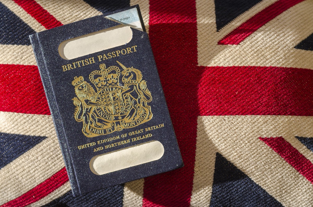 Expired British Passport with Blue Cover xkwx brexit, united, great, northern, ireland, old, expired, blue, black, style, identity, holiday, id, travel, passport, document, british, uk, immigration, b ...
