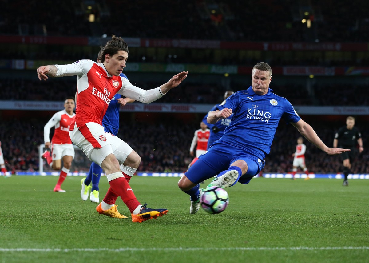 Arsenal s Hector Belerin tussles with Leicester s Robert Huth during the Premier League match at the Emirates Stadium, London. Picture date: April 26th, 2017. Pic credit should read: David Klein/Sport ...