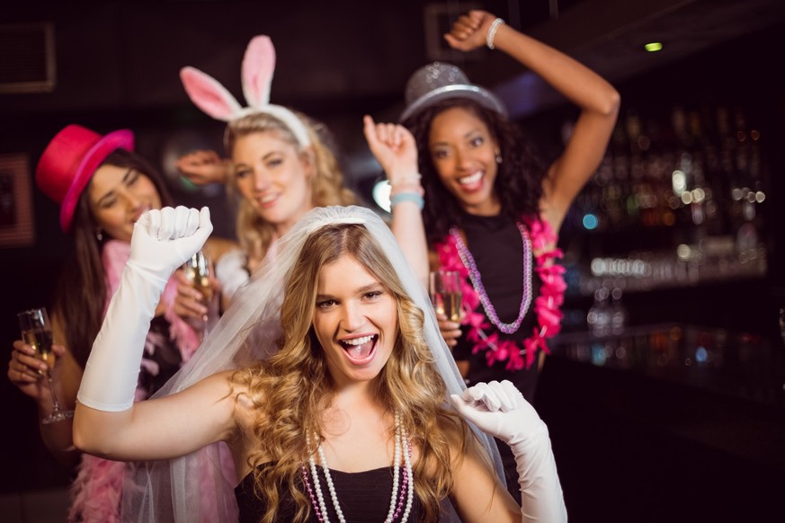 Friends celebrating bachelorette party in a nightclub