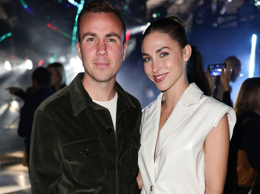 MILAN, ITALY - SEPTEMBER 22: Mario Götze and Ann-Kathrin Götze are seen at the Boss Fashion Show during the Milan Fashion Week Womenswear Spring/Summer 2023 on September 22, 2022 in Milan, Italy. (Pho ...