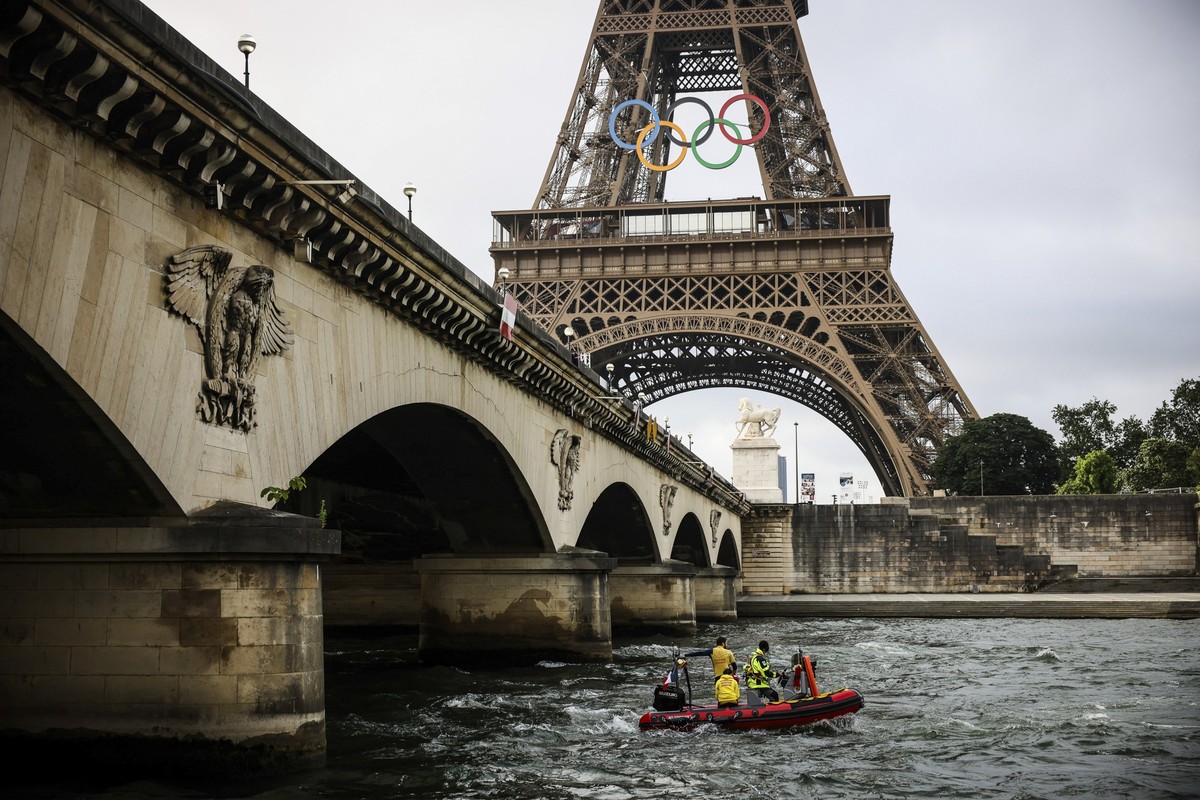 A rescue boat cruises on the Seine river near the Eiffel Tower during a rehearsal for the Paris 2024 Olympic Games opening ceremony, Monday, June. 17, 2024 in Paris. The river will host the Paris 2024 ...