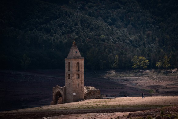 April 6, 2023, Catalonia, Spain: The old church of Sant Romo de Sau, a parish church from the 11th century, is back on dry land in the middle of the Sau reservoir, which has shrunk by some 90% due to  ...
