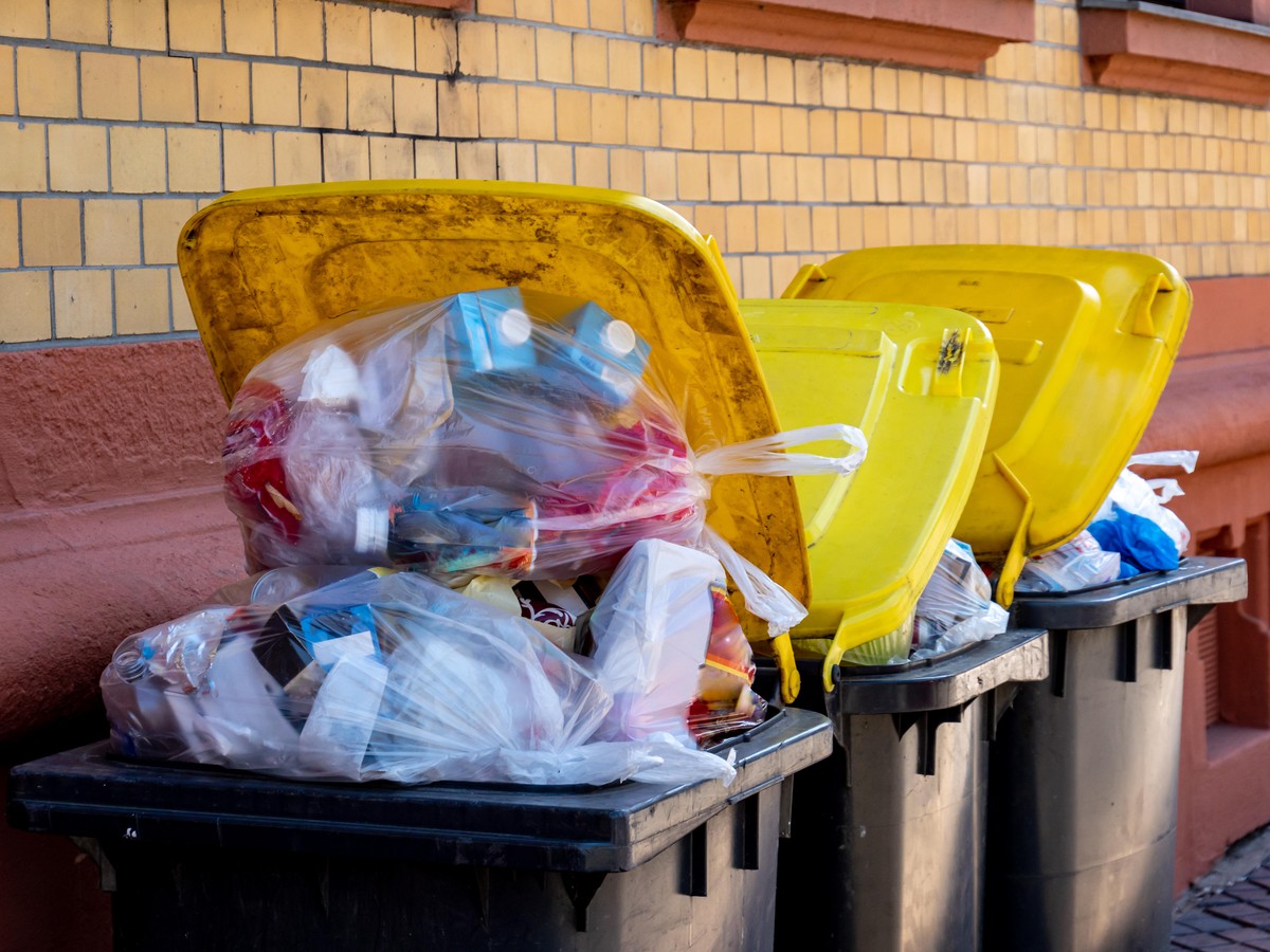 Full garbage bins plastic of the city