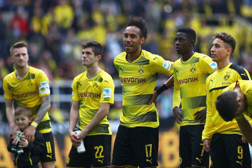 DORTMUND, GERMANY - MAY 20: Sokratis Papastathopoulos, Ousmane Dembele, Christian Pulisic, Raphael Guerreiro, Nuri Sahin and Pierre-Emerick Aubameyang of Borussia Dortmund celebrate in front of the Ko ...