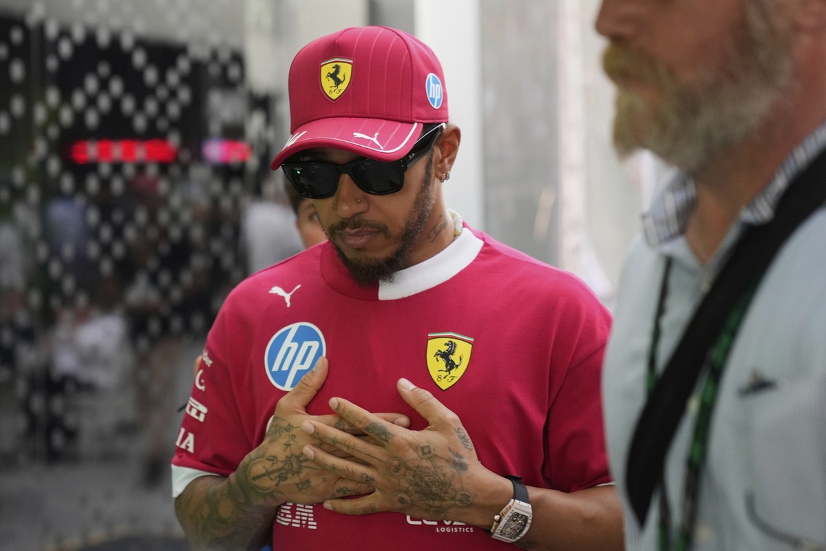 Ferrari driver Lewis Hamilton of Britain arrives prior to the Formula One Saudi Arabian Grand Prix at the Jeddah Corniche Circuit in Jeddah, Saudi Arabia, Sunday, April 20, 2025. (AP Photo/Darko Bandi ...