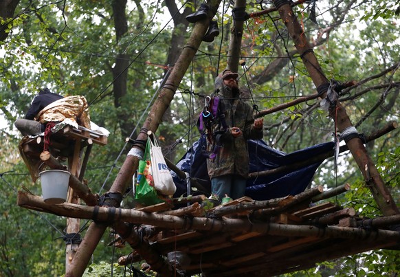 Activists are seen at the treehouse, as police forces prepare to clear the area at the &quot;Hambacher Forst&quot; in Kerpen-Buir near Cologne, Germany, September 13, 2018, where protesters have built ...