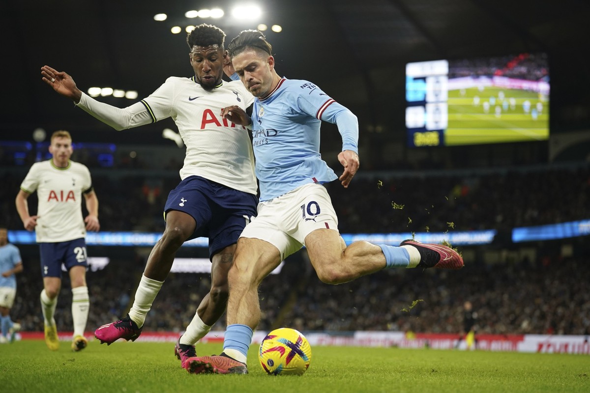 Manchester City&#039;s Jack Grealish, right, fights for the ball with Tottenham&#039;s Emerson Royal during the English Premier League soccer match between Manchester City and Tottenham Hotspur at the ...