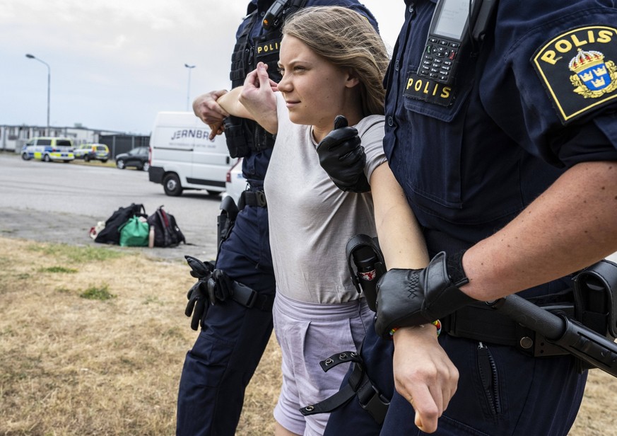 Police remove Greta Thunberg as they move climate activists from the organization Ta Tillbaka Framtiden, who are blocking the entrance to Oljehamnen in Malmo, Sweden, on June 19, 2023, for the 5th day ...