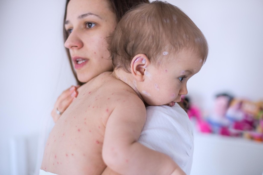 Mother nursing sick child At Home