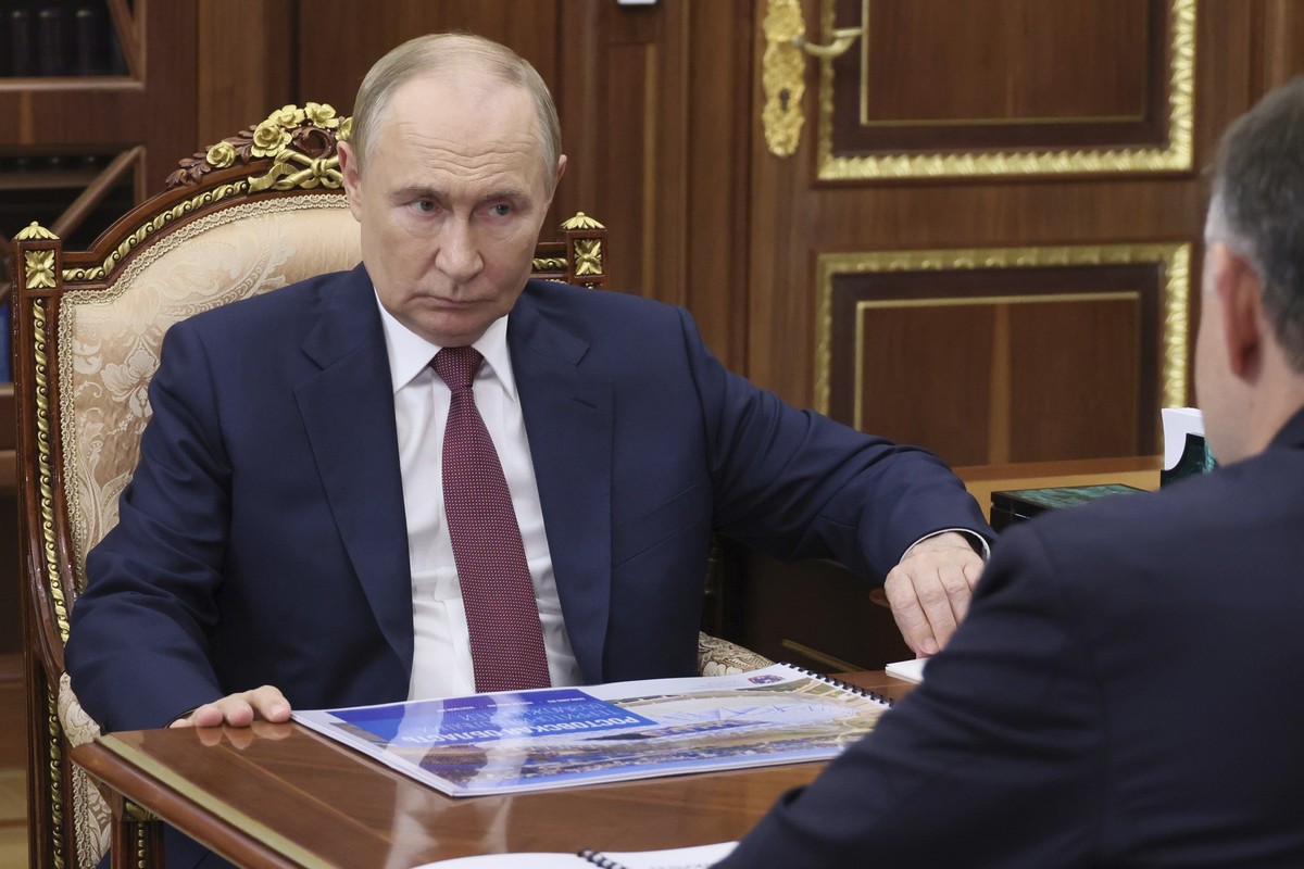 Russian President Vladimir Putin attends a meeting with acting governor of the Rostov region Yuri Slyusar at the Kremlin in Moscow, Russia, Monday, Aug. 18, 2025. (Vyacheslav Prokofyev, Sputnik, Kreml ...