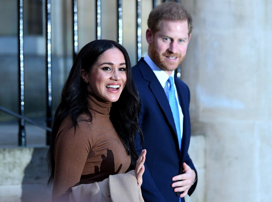 Britain's Prince Harry and his wife Meghan, Duchess of Sussex react as they leave after their visit to Canada House in London, Britain January 7, 2020. Daniel Leal-Olivas/Pool via REUTERS
