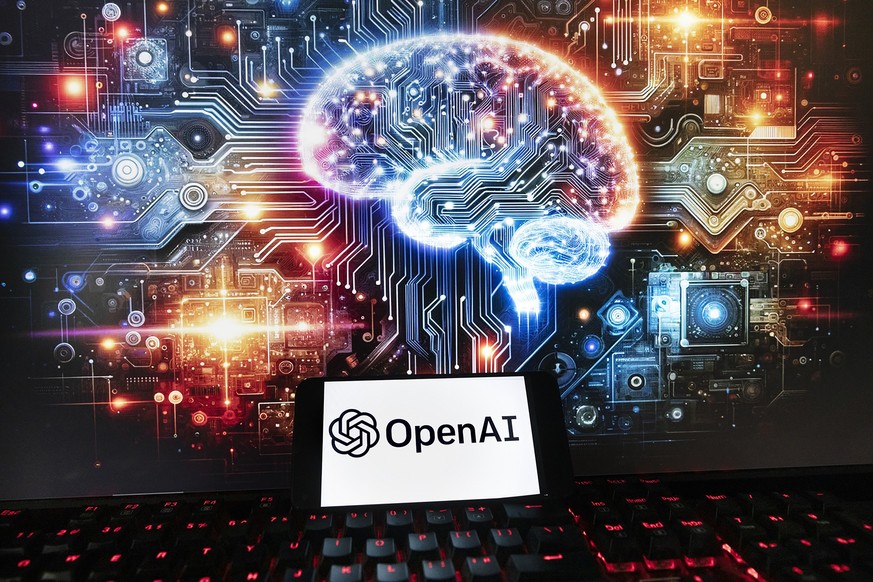 FILE - The OpenAI logo is displayed on a cell phone with an image on a computer monitor generated by ChatGPT&#039;s Dall-E text-to-image model, Friday, Dec. 8, 2023, in Boston. The maker of ChatGPT is ...