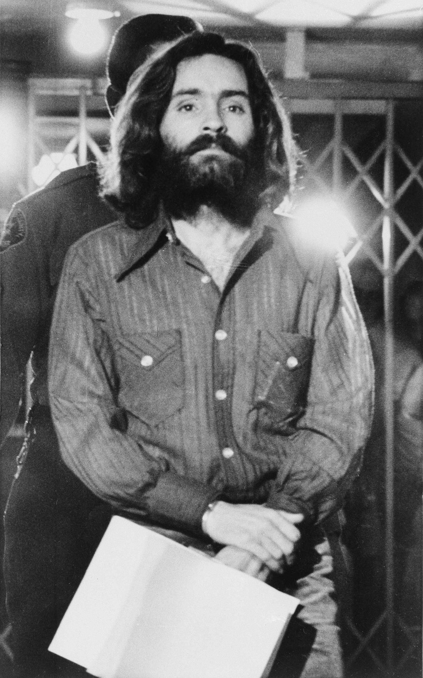 Charles M. Manson, leader of the cult-like band of hippies, accused of multiple murders, leaves a Los Angeles courtroom after telling a judge &quot;lies have been told&quot; about him, Dec. 22, 1969.  ...