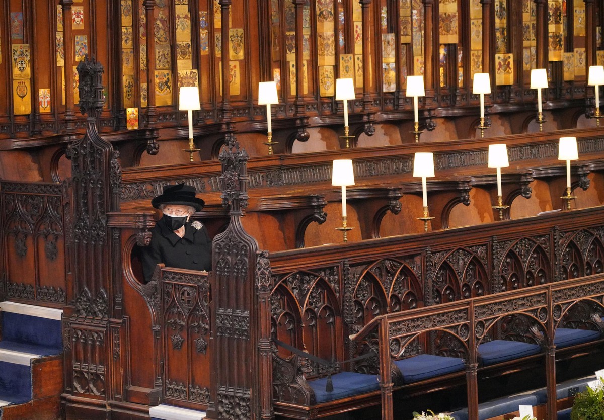Queen Elizabeth II takes her seat for the funeral of the Duke of Edinburgh in St George&#039;s Chapel, Windsor Castle, Berkshire., Credit:Jonathan Brady / Avalon