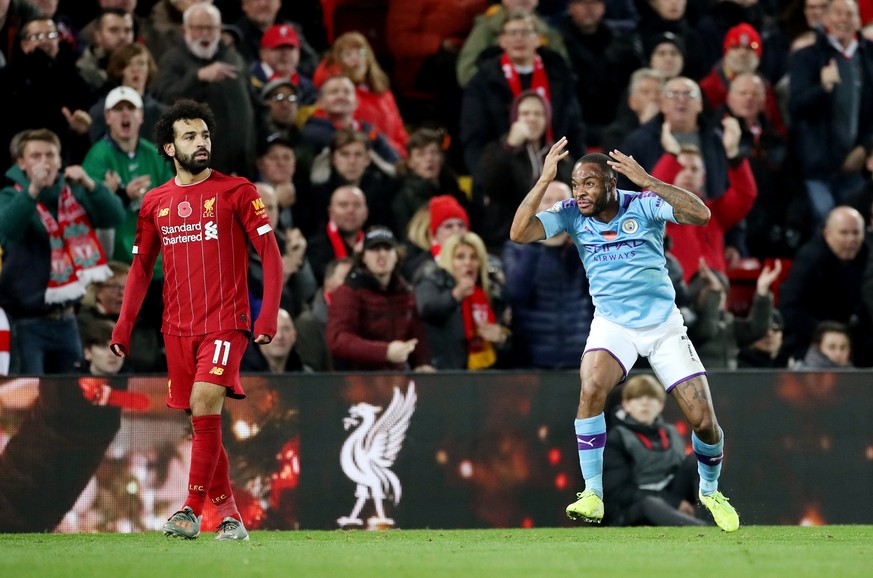 Soccer Football - Premier League - Liverpool v Manchester City - Anfield, Liverpool, Britain - November 10, 2019 Manchester City's Raheem Sterling reacts as Liverpool's Mohamed Salah looks on Action I ...