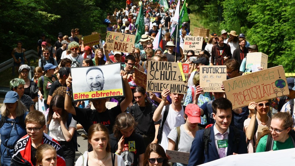 GROSSRASCHEN, GERMANY - JUNE 25: Climate activists protest at the Welzow Sued open-cast coal mine on June 25, 2023 near Grossraeschen, Germany. Activists from a variety of climate action groups, inclu ...
