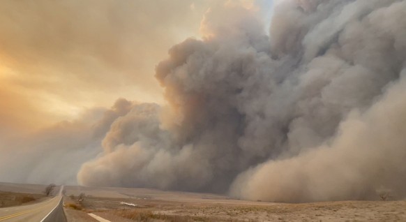 Smoke rises from a wildfire in Texas, U.S., February 27, 2024 in this screen grab obtained from a social media video. Jeff Bartlett/via REUTERS THIS IMAGE HAS BEEN SUPPLIED BY A THIRD PARTY. MANDATORY ...