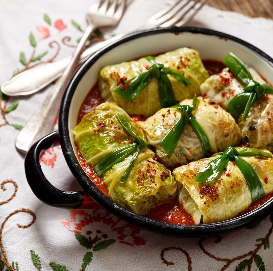 Cabbage rolls, stuffed cabbage with rice and mushrooms in tomato sauce