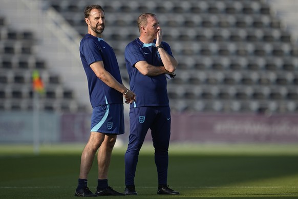 England&#039;s head coach Gareth Southgate, left, and assistant Steve Holland watch during an official training session at Al Wakrah Sports Complex on the eve of the group B World Cup soccer match bet ...