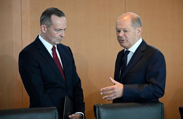 German Chancellor Olaf Scholz (R) speaks with German Minister for Transport and Digital Affairs Volker Wissing prior to the start of the weekly cabinet meeting at the Chancellery in Berlin on June 7,  ...