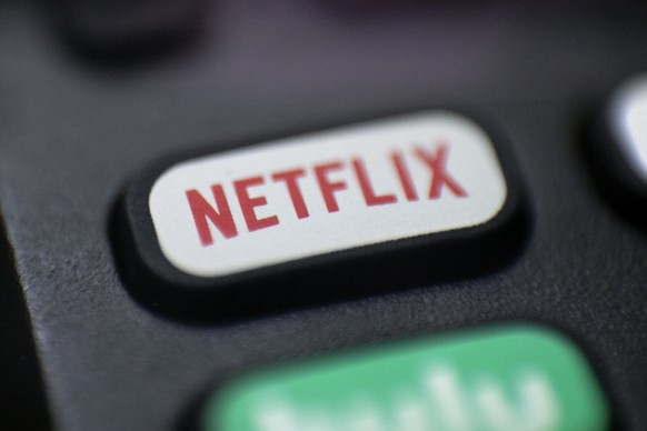 FILE - The Netflix logo is pictured on a remote control in Portland, Ore., Aug. 13, 2020. Netflix said Wednesday, Dec. 21, 2022, that it plans to build a state-of-the-art production facility at a form ...
