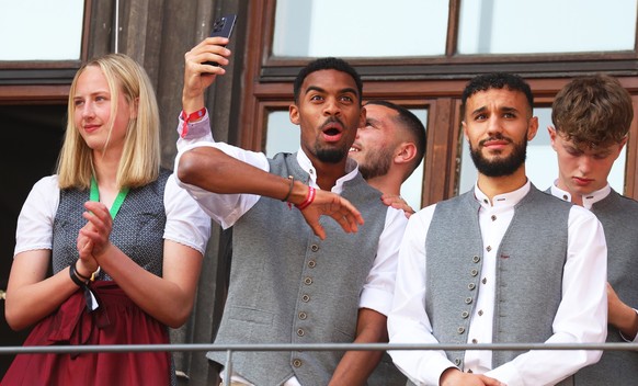 May 28, 2023, Bavaria, Munich: Football: Bundesliga, Bayern Munich, Championship Celebration.  Ryan Gravenberch (M) from Bavaria cheering on the balcony of the town hall.  Bayern Munich's men are in S for the eleventh time.