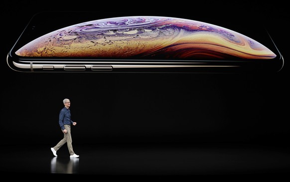 Apple CEO Tim Cook speaks about the Apple iPhone XS at the Steve Jobs Theater during an event to announce new Apple products Wednesday, Sept. 12, 2018, in Cupertino, Calif. (AP Photo/Marcio Jose Sanch ...